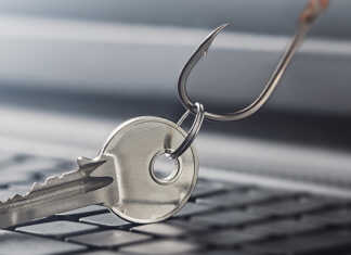 A key being dragged across a keyboard by a fishing hook.