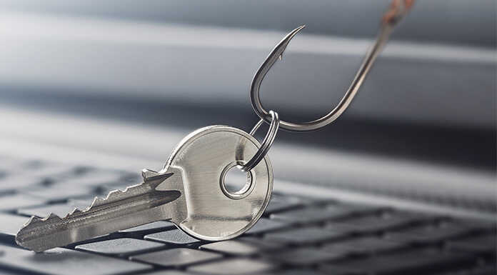 A key being dragged across a keyboard by a fishing hook.
